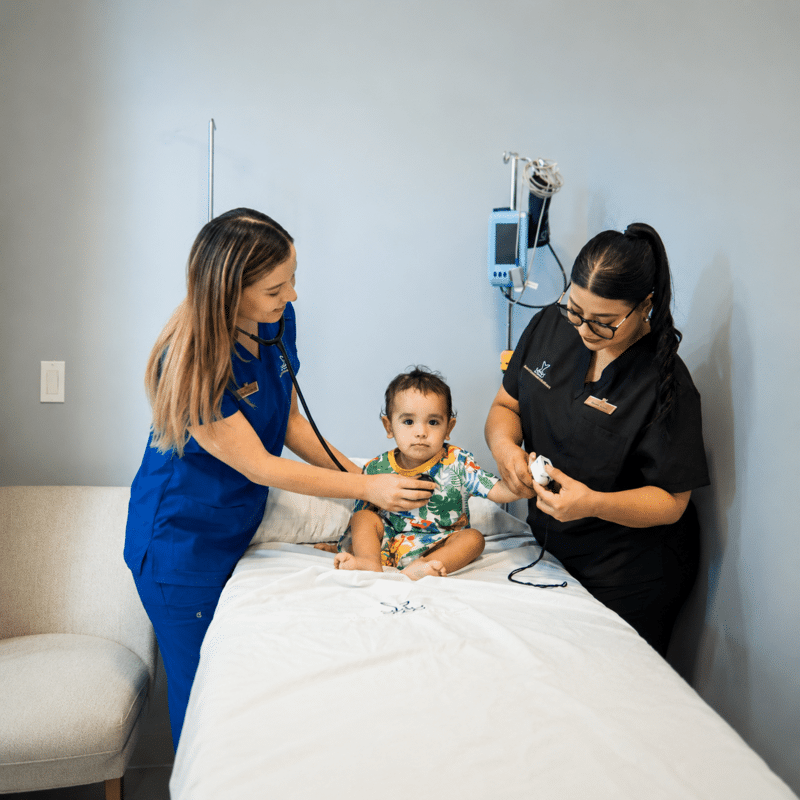 Medical professionals caring for a young patient at a clinic in Los Cabos.